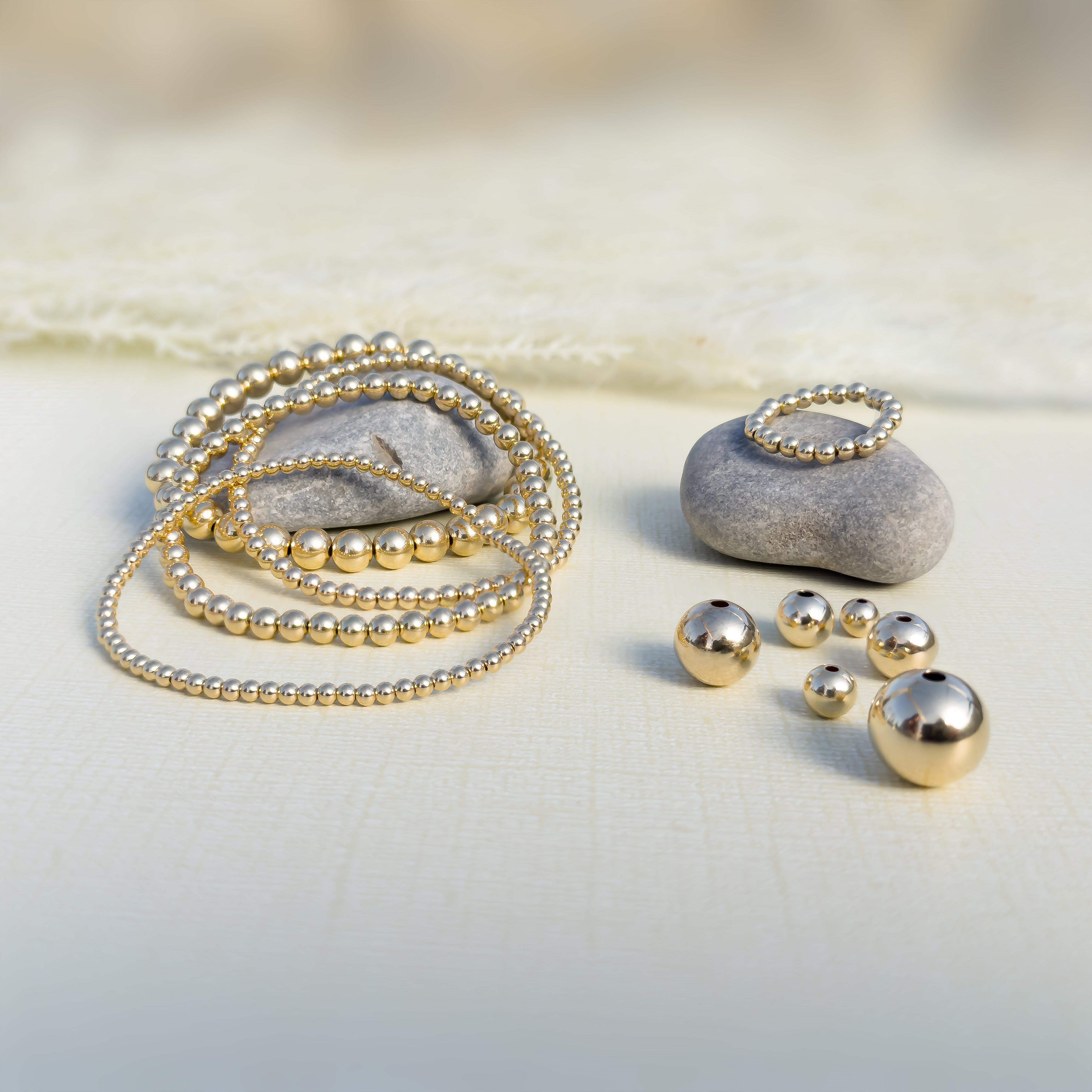 Plain Round Beads and Stretchy Bracelets and Rings on Paper